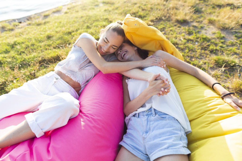 women-relaxing-colorful-beanbags