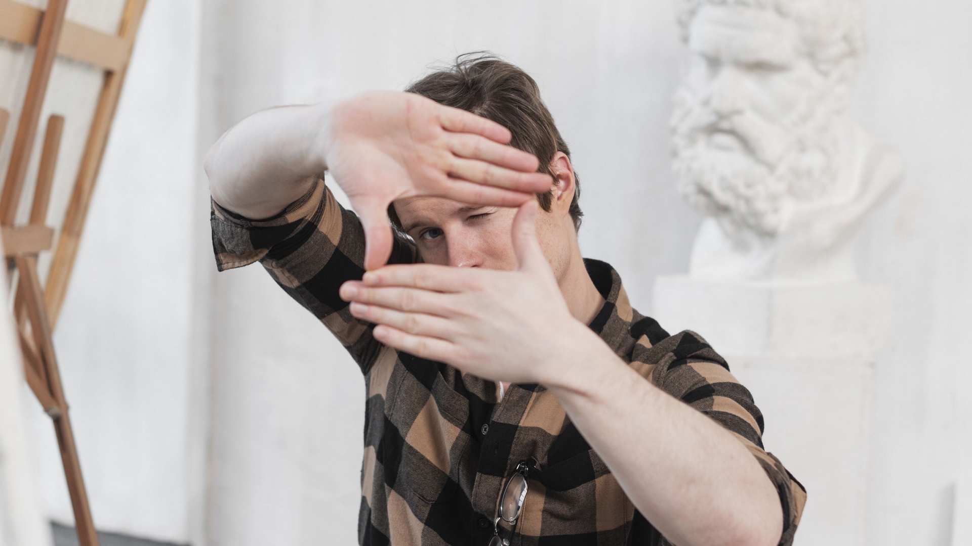 man-artist-making-frame-with-his-fingers-freepik-