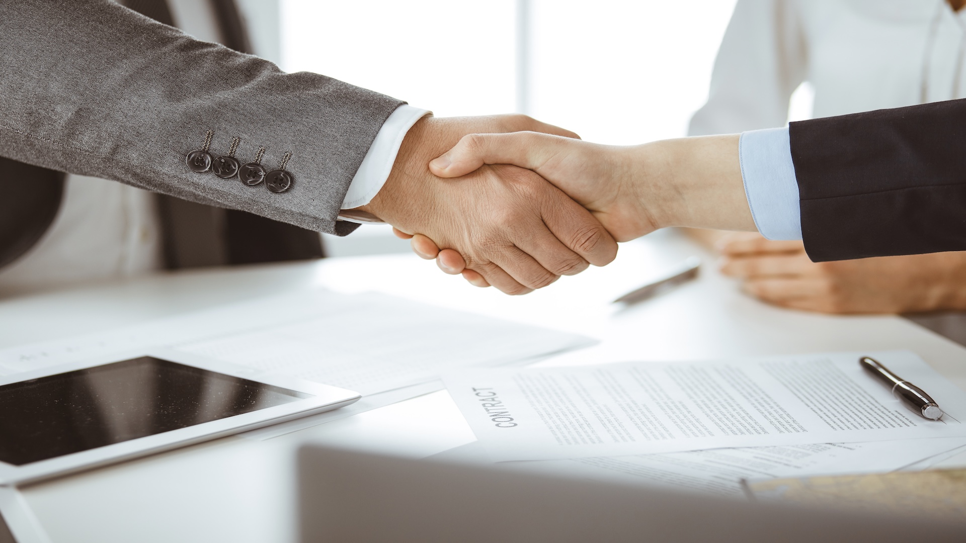 business-people-shaking-hands-finishing-contract-signing-close-up-business-communication-concept-handshake-marketing